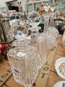 A PAIR OF CUT GLASS DECANTERS, AND A GRADUATED PAIR OF SQUARE FORM DECANTERS.