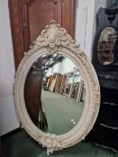 AN IMPRESSIVE PAIR OF LARGE VICTORIAN STYLE OVAL WALL MIRRORS.