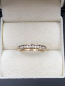 A 9ct HALLMARKED GOLD CHANNEL SET DIAMOND RING. FINGER SIZE P. WEIGHT 2.26grms.