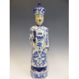 A CHINESE BLUE AND WHITE FIGURE OF A STANDING MANDARIN. H 36cms.