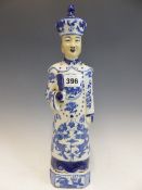 A CHINESE BLUE AND WHITE FIGURE OF A STANDING MANDARIN. H 36cms.