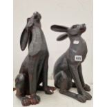 A PAIR OF DECORATIVE SEATED HARE FIGURES