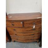 A MAHOGANY BOW FRONT CHEST OF DRAWERS