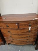 A MAHOGANY BOW FRONT CHEST OF DRAWERS