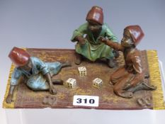 A BERGMAN COLD PAINTED BRONZE GROUP OF THREE MOROCCAN BOYS PLAYING DICE ON A CARPET, B IN A VASE AND