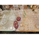 VARIOUS GLASS WARES TO INCLUDE THREE DECANTERS, FRUIT BOWLS, VASES, AND DRINKING WARES.