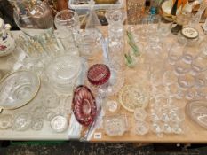 VARIOUS GLASS WARES TO INCLUDE THREE DECANTERS, FRUIT BOWLS, VASES, AND DRINKING WARES.