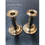 A PAIR OF VINTAGE HALLMARKED SILVER LOADED CANDLESTICKS.