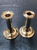 A PAIR OF VINTAGE HALLMARKED SILVER LOADED CANDLESTICKS.