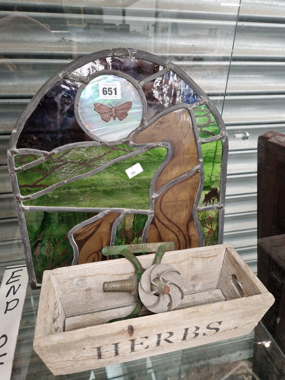 A STAINED GLASS PANEL OF A DOG AND HARE, A HERB BOX AND A WATER SPRINKLER