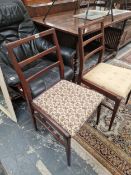 A SET OF FOUR RETRO TEAK DINING CHAIRS.