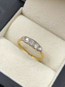 AN ANTIQUE FIVE STONE GRADUATED DIAMOND BOAT STYLE RING. STAMPED 18ct. FINGER SIZE O 1/2. WEIGHT 2.