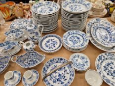 AN ANTIQUE, MEISSEN ONION PATTERN PART DINNER SERVICE BY VARIOUS MAKERS.