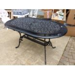 A BLACK PAINTED CAST ALLOY PATIO TABLE