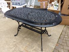 A BLACK PAINTED CAST ALLOY PATIO TABLE