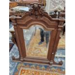 A FRENCH WALNUT OVER MANTLE MIRROR.