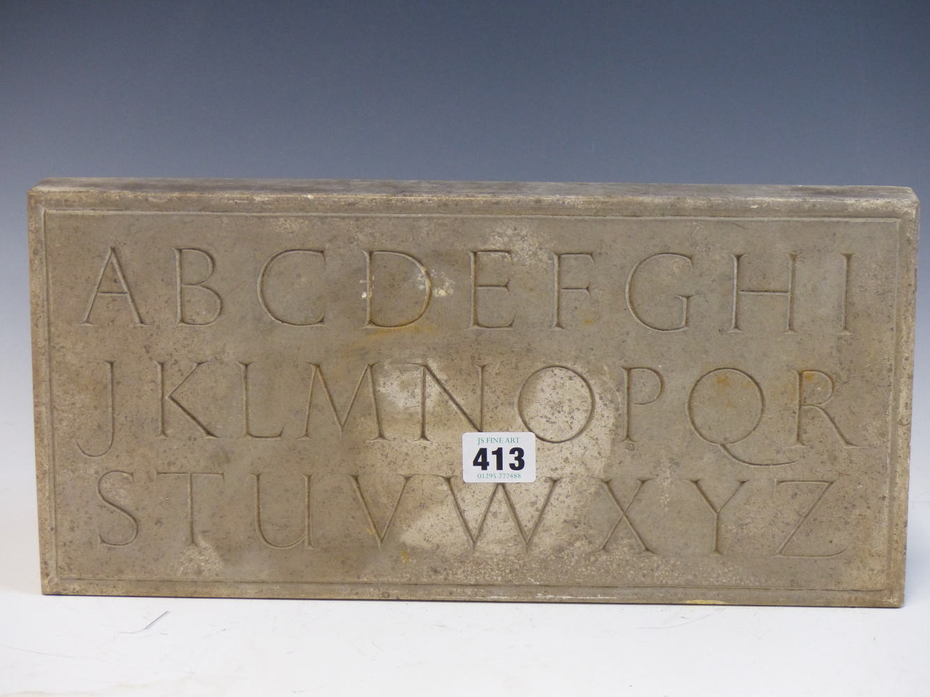 MICHAEL ROYDE-SMITH, ARR, A RECTANGULAR LIMESTONE TABLET CARVED WITH THE ALPHABET. 18 x 37.5cms.
