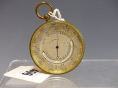 A POCKET BAROMETER WITH INSET MERCURY THERMOMETER IN A GILT CASE. Dia. 5cms.
