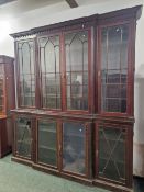 A LARGE LATE VICTORIAN MAHOGANY BREAK FRONT BOOKCASE.