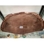 AN ANTIQUE COPPER TRAY WITH WRIGGLE WORK DECORATION