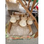 A FIVE LIGHT BRASS AND GLASS CHANDELIER TOGETHER WITH TWO OIL LAMP STORM FUNNELS