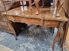 AN ANTIQUE FRENCH WALNUT AND INLAID BRASS MOUNTED WRITING TABLE.