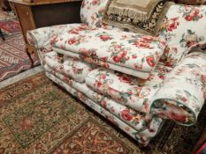 A GOOD QUALITY ANTIQUE STYLE TWO SEAT SOFA AND MATCHING FOOTSTOOL.