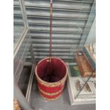 A RED LEATHER BOUND WASTE PAPER BASKET TOGETHER WITH A MAHOGANY WALKING CANE SCREWING TOGETHER IN