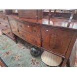 AN ANTIQUE MAHOGANY BOW FRONT SIDE BOARD