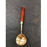 AN ARTS AND CRAFTS SILVER SPOON, LONDON 1927 WITH A RED AGATE HANDLE