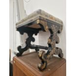 A VICTORIAN EBONISED AND GILT DECORATED DRESSING STOOL