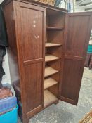 AN EDWARDIAN MAHOGANY HALL CUPBOARD WITH SHELVED INTERIOR
