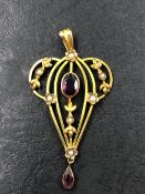AN ANTIQUE EDWARDIAN SEED PEARL AND GEMSET PENDANT. THE PENDANT WITH A 9ct TAG STAMP ON REVERSE,