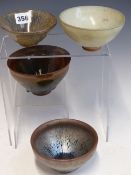 FOUR CHINESE BOWLS GLAZED IN THE SONG STYLE IN HARES FUR AND JUN TYPE GLAZES, THE LARGEST. Dia. 12.