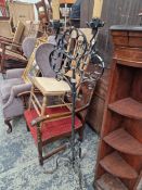 A WROUGHT IRON LAMP STAND