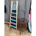 A BRAZIER, PAINTED BENCH ENDS, STEP LADDER, ROLLS OF CHICKEN WIRE, GARDEN EDGING ETC