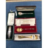 A CASED GEORG JENSON 2002 SILVER GILT SPOON, TWO CASED ENGLISH SILVER SPOONS AND AN EIIR 2002 SILVER