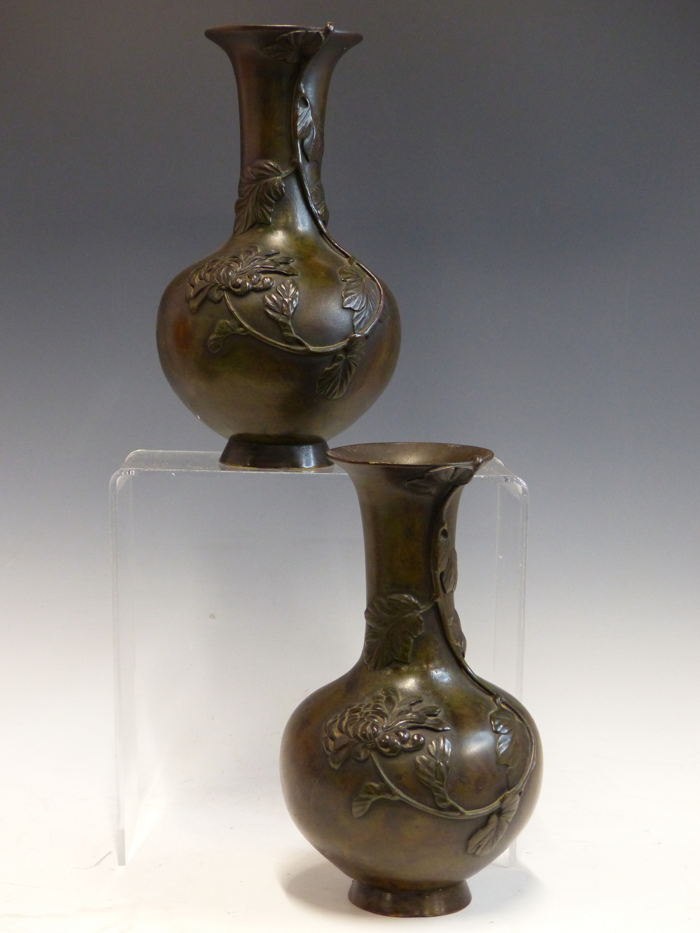 A PAIR IF EARLY 20th C. JAPANESE BRONZE BOTTLE SHAPED VASES CAST WITH STEMS OF CHRYSANTHEMUMS
