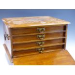 AN EARLY 20th C. OAK TWO HANDLED CANTEEN, THE PULL DOWN FRONT OVER FOUR FITTED DRAWERS LINED IN BLUE