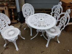 A WHITE PAINTED CAST ALLOY PATIO TABLE WITH TWO PAIRS OF SIMILAR CHAIRS