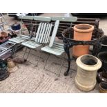 A BLACK PAINTED CAST IRON PUB TABLE BASE, FOUR FOLDING GARDEN CHAIRS AND TWO CHIMNEY POTS