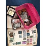 A SMALL COLLECTION OF WORLD COINS, VARIOUS MEDALLIONS AND A STAMP ALBUM.