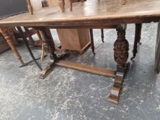 A SMALL OAK REFECTORY TYPE TABLE.
