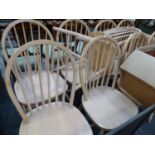 A SET OF NINE SPINDLE BACK DINING CHAIRS.
