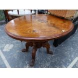 A VICTORIAN WALNUT AND INLAID TILT TOP TABLE.