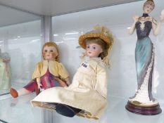 A VINTAGE ARMAND MARSAILLE DOLL, AND A LATER COMPOSITION HEAD DOLL, TOGETHER WITH TWO FIGURINES .