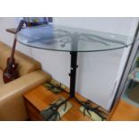 A WROUGHT IRON BASED GLASS TOP HALL TABLE.