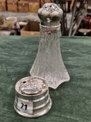 A HALLMARKED SILVER CAPSTAN SMALL INKWELL TOGETHER WITH A SILVER MOUNTED GLASS CASTOR.