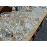 A LARGE SELECTION OF VINTAGE CUT GLASS DRINKING GLASSWARES, BOWLS, DECANTERS ETC. TOGETHER WITH A