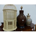 TWO TABLE LAMPS AND A WOODEN BIRDCAGE.